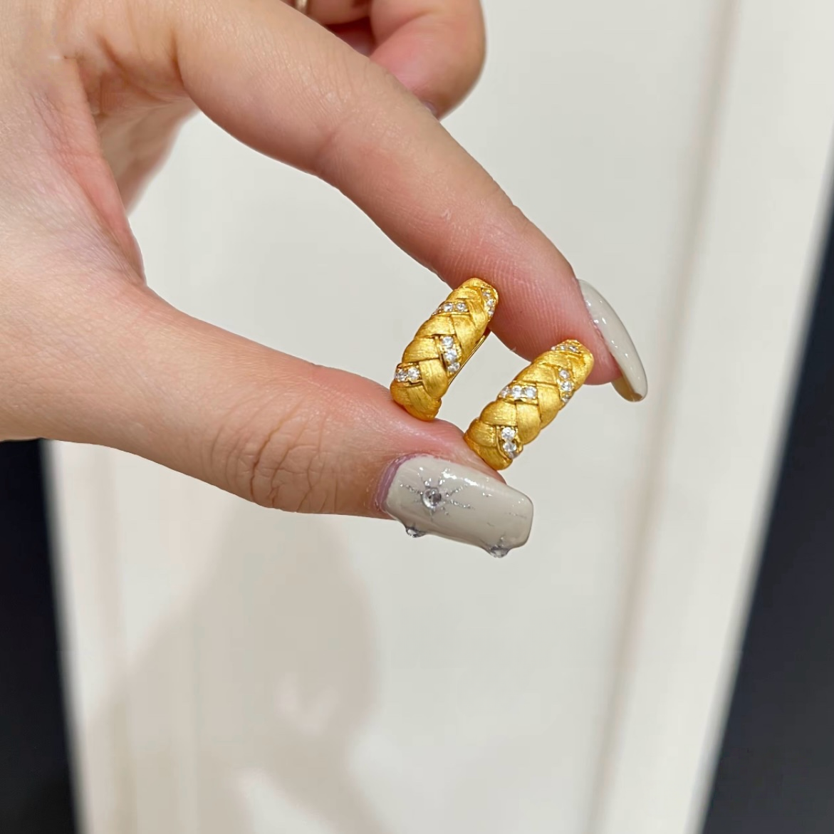 18K gold-plated sterling silver twisted huggie earrings with brushed texture and cubic zirconia accents