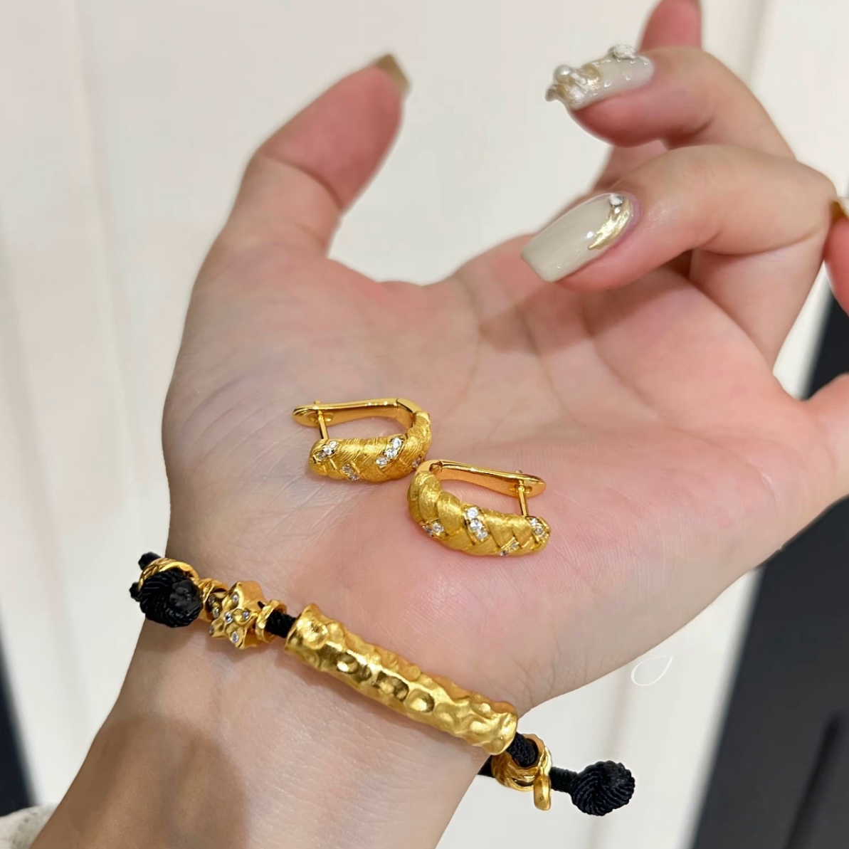 18K gold-plated sterling silver twisted huggie earrings with brushed texture and cubic zirconia accents