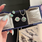 925 sterling silver oval synthetic YAG stud earrings in Paraiba blue and mint green with cubic zirconia halo surrounds and butterfly backs