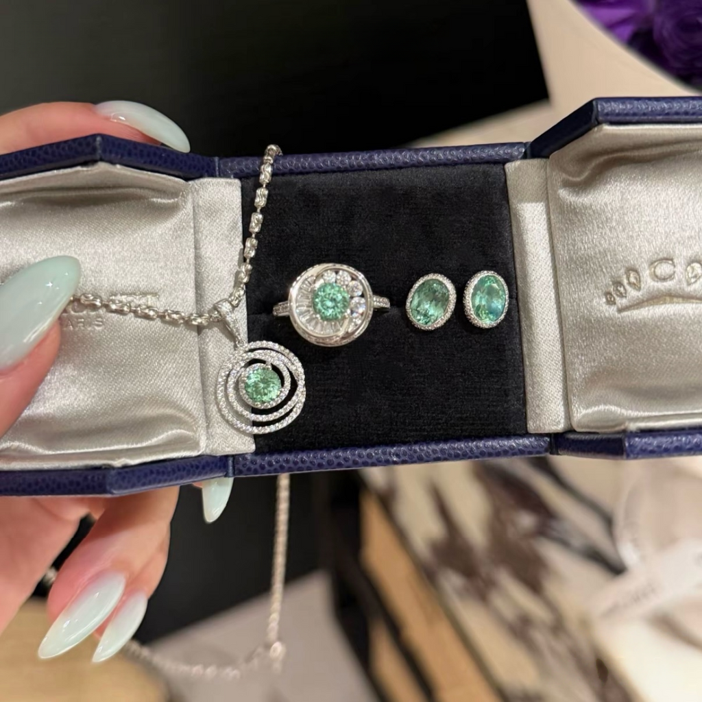 925 sterling silver oval synthetic YAG stud earrings in Paraiba blue and mint green with cubic zirconia halo surrounds and butterfly backs