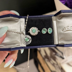 925 sterling silver oval synthetic YAG stud earrings in Paraiba blue and mint green with cubic zirconia halo surrounds and butterfly backs