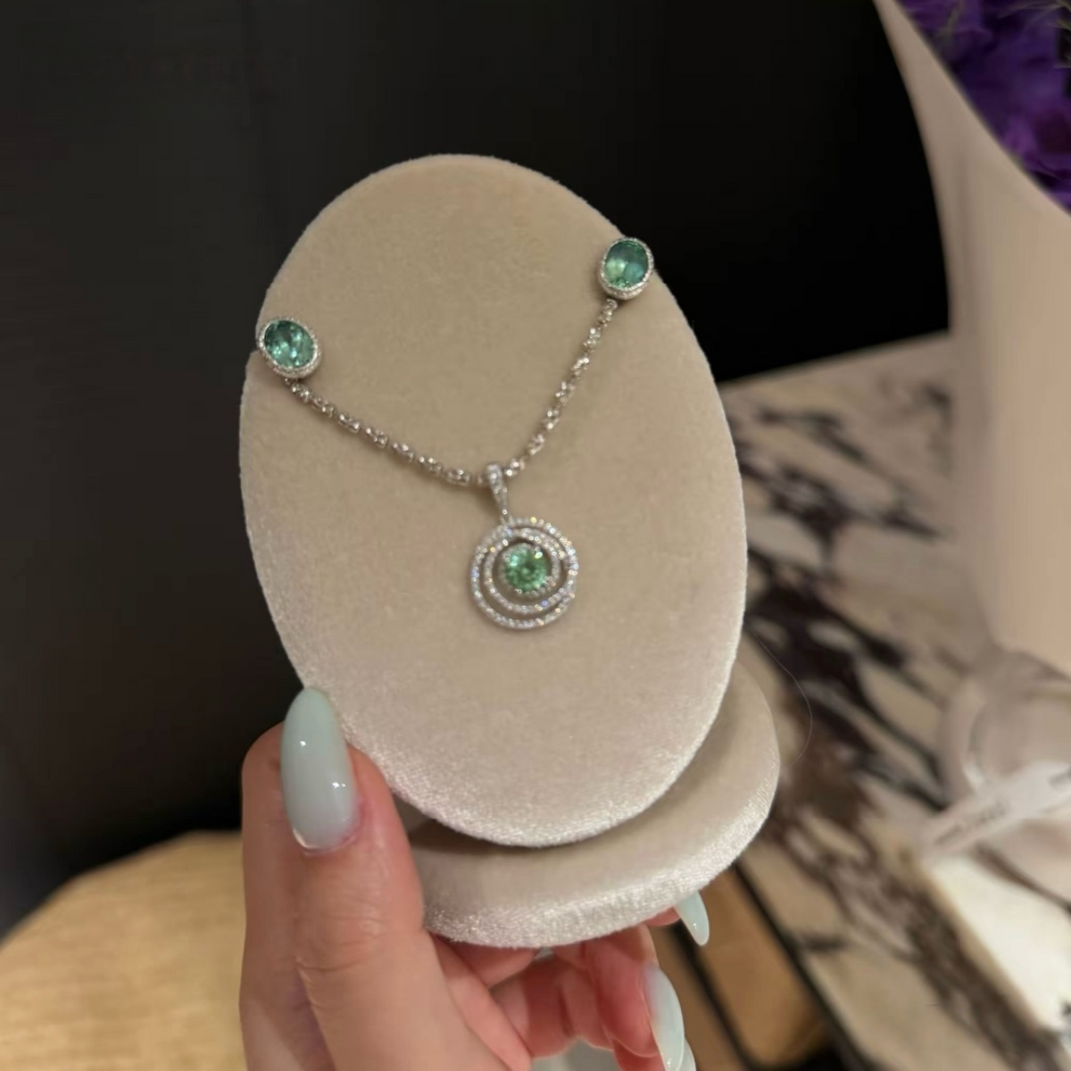 925 sterling silver oval synthetic YAG stud earrings in Paraiba blue and mint green with cubic zirconia halo surrounds and butterfly backs