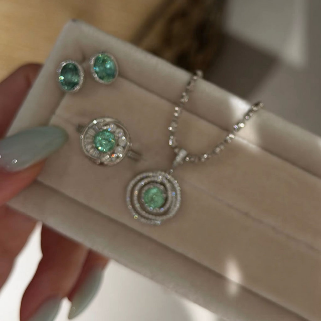 925 sterling silver oval synthetic YAG stud earrings in Paraiba blue and mint green with cubic zirconia halo surrounds and butterfly backs