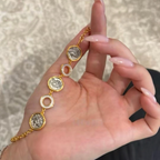 18K gold-plated sterling silver coin bracelet with mother-of-pearl ring accents