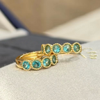 18K gold-plated sterling silver huggie earrings with round aqua cubic zirconia and beaded bezel-style frames