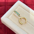 18K gold-plated sterling silver huggie earrings with round aqua cubic zirconia and beaded bezel-style frames