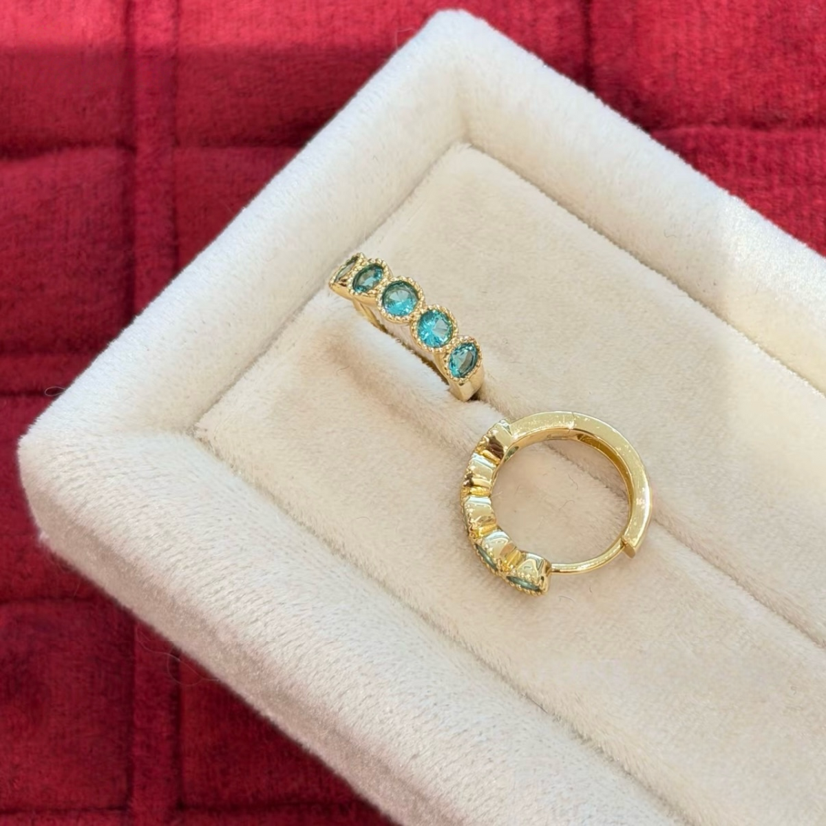 18K gold-plated sterling silver huggie earrings with round aqua cubic zirconia and beaded bezel-style frames