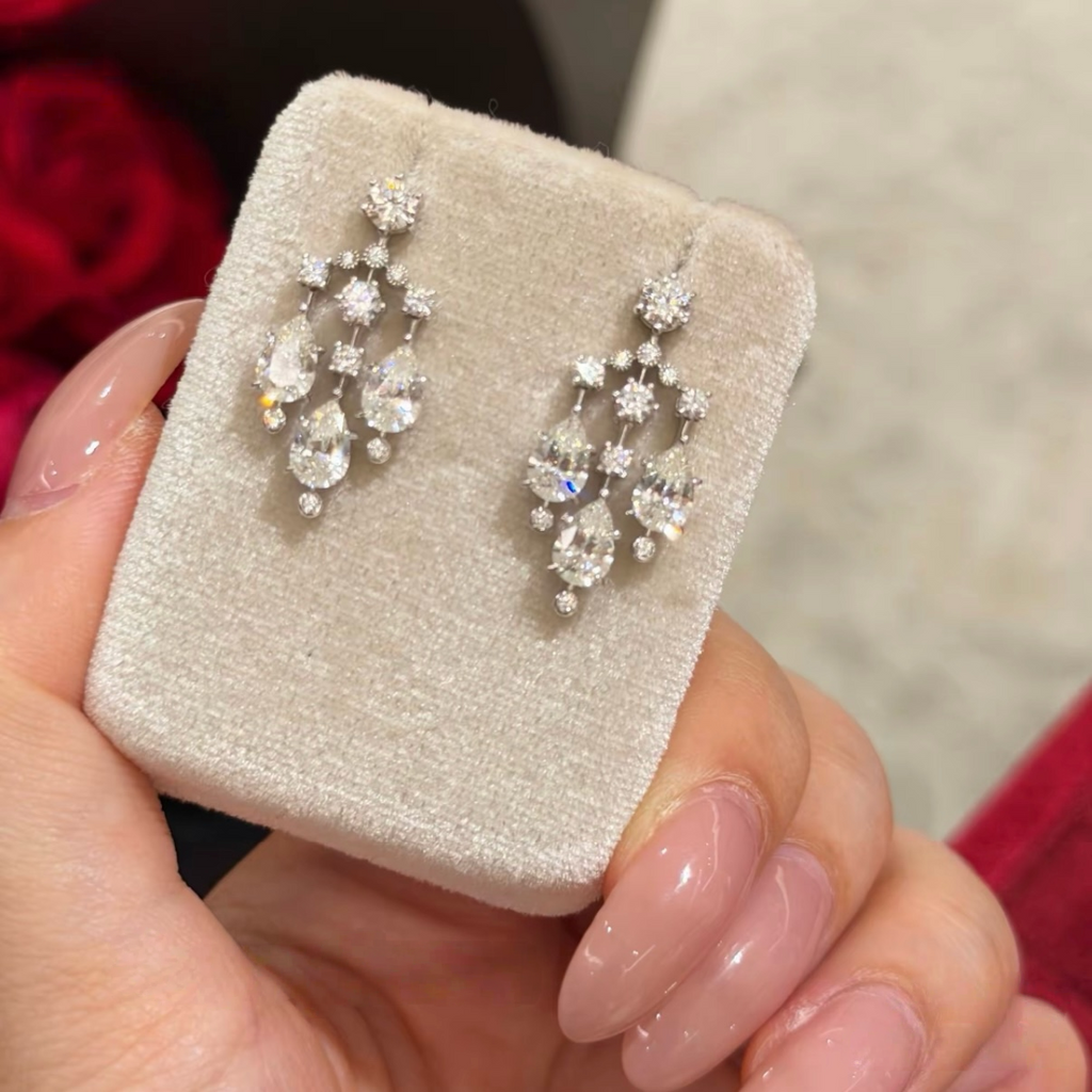 Sterling silver chandelier-style drop earrings with pear-cut and round cubic zirconia