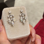 Sterling silver chandelier-style drop earrings with pear-cut and round cubic zirconia