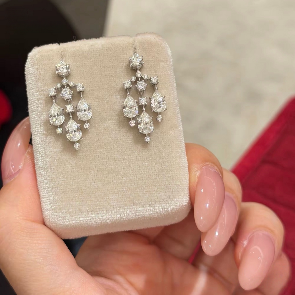 Sterling silver chandelier-style drop earrings with pear-cut and round cubic zirconia