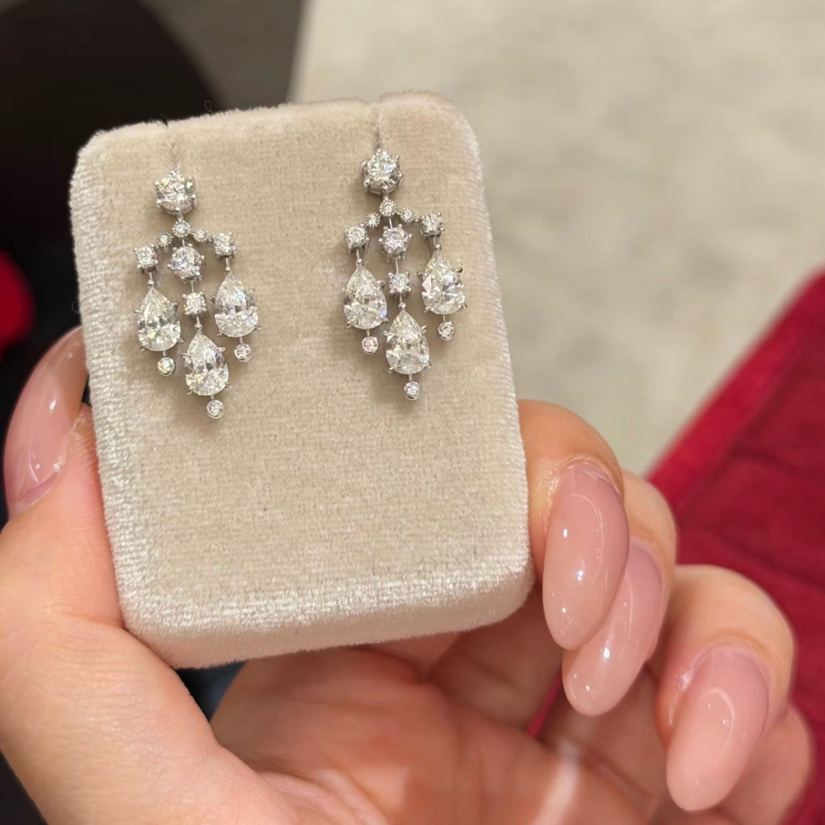 Sterling silver chandelier-style drop earrings with pear-cut and round cubic zirconia