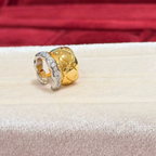 Two-tone sterling silver ear cuff with an 18K gold-plated quilted band and a cubic zirconia-set silver wave band