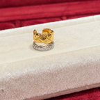 Two-tone sterling silver ear cuff with an 18K gold-plated quilted band and a cubic zirconia-set silver wave band