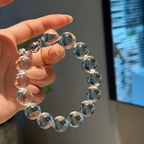 Natural rock crystal bracelet with 12–13 mm round beads, polished 925 sterling silver details, and a magnetic clasp