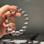 Natural rock crystal bracelet with 12–13 mm round beads, polished 925 sterling silver details, and a magnetic clasp
