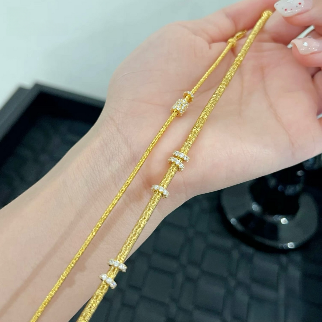 Slim textured 925 sterling silver bracelet with movable pavé cubic zirconia rings, available in silver and 18K gold-plated finishes