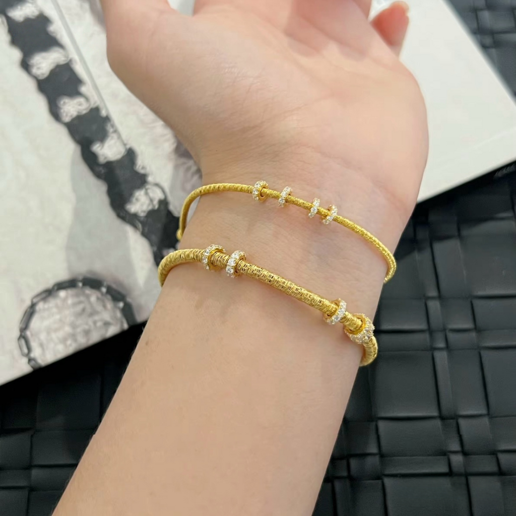 Slim textured 925 sterling silver bracelet with movable pavé cubic zirconia rings, available in silver and 18K gold-plated finishes