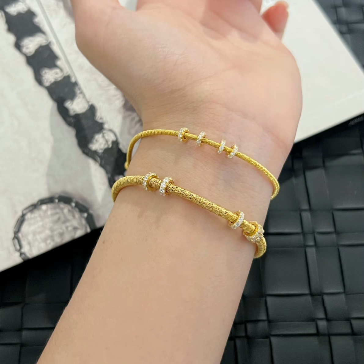 Slim textured 925 sterling silver bracelet with movable pavé cubic zirconia rings, available in silver and 18K gold-plated finishes