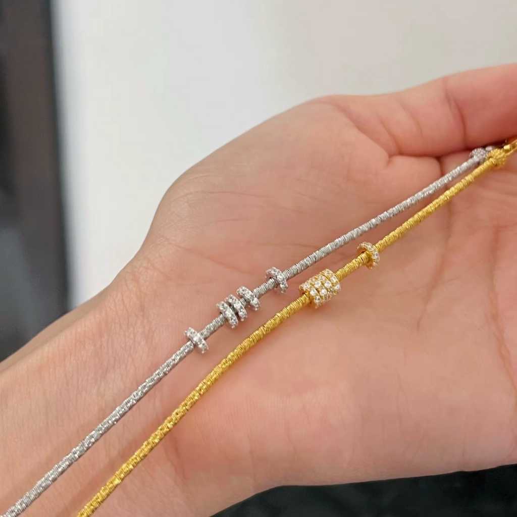 Slim textured 925 sterling silver bracelet with movable pavé cubic zirconia rings, available in silver and 18K gold-plated finishes