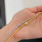 Slim textured 925 sterling silver bracelet with movable pavé cubic zirconia rings, available in silver and 18K gold-plated finishes