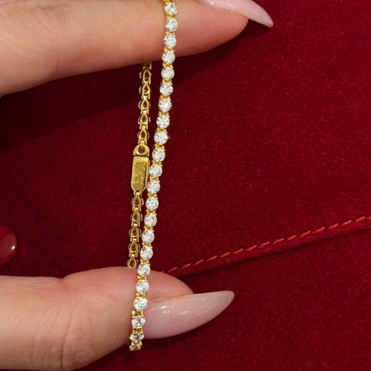 2.5 mm gold tennis bracelet with round white cubic zirconia stones in 18K gold-plated sterling silver